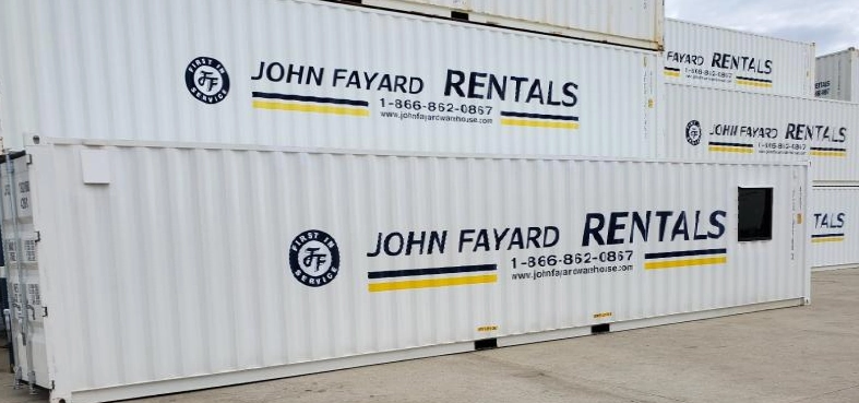 container, warehouse, and office storage units stacked in a parking lot